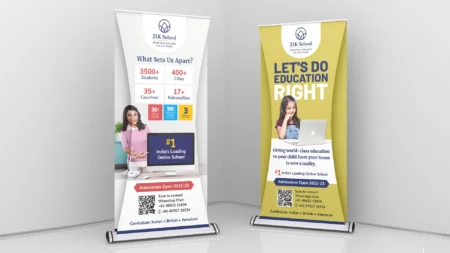two roll up banners with a woman on a laptop