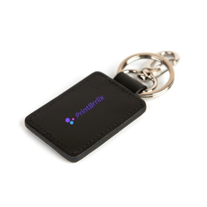 a black key chain with a logo on it